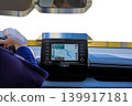Driver hand on steering wheel with car navigation system dashboard screen displaying map, vehicle interior isolated on transparent background. High quality photo 139917181