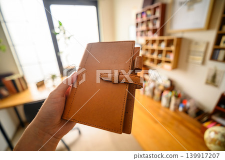 I picked up a leather notebook. 139917207