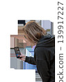 Woman takes a photo on a mobile phone against a transparent background. High quality photo 139917227