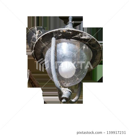 An old street lantern covered in cobwebs and dust with a glowing light bulb inside on an isolated transparent background. High quality photo An old street lantern covered in cobwebs and dust with a glowing light bulb inside on an isolated transparent background. High quality photo 139917231
