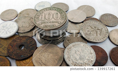 Collection of antique Indonesian and international coins, including the 100 Rupiah Coin from 1973. Collection of antique Indonesian and international coins, including the 100 Rupiah Coin from 1973. 139917261