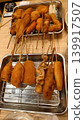 Delicious-looking kushikatsu, a specialty of Osaka, served on a metal tray. 139917507