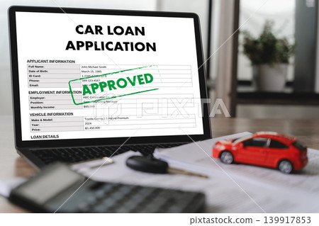 Approved car loan application form displayed on laptop with vehicle model, calculator, car key, and financial documents for online financing, banking approval, and credit verification. Approved car loan application form displayed on laptop with vehicle model, calculator, car key, and financial documents for online financing, banking approval, and credit verification. 139917853
