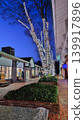 Christmas lights at a shopping mall, shining brightly in the winter twilight. 139917896