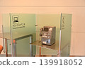 Public telephones and computer desks with partitions installed in public facilities 139918052