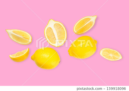 Whole lemons and lemon slices are placed together on pink Whole lemons and lemon slices are placed together on pink 139918096