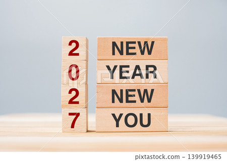 hand holding wooden block with text 2027 NEW YEAR NEW YOU on table background. Resolution, strategy, goal, business and holiday concepts hand holding wooden block with text 2027 NEW YEAR NEW YOU on table background. Resolution, strategy, goal, business and holiday concepts 139919465