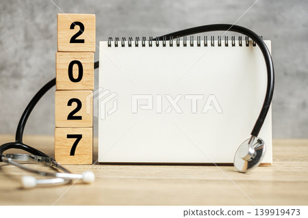 2027 Happy New Year for healthcare, Insurance, Wellness and medical concept. Stethoscope and blank notebook for copy space your text 2027 Happy New Year for healthcare, Insurance, Wellness and medical concept. Stethoscope and blank notebook for copy space your text 139919473