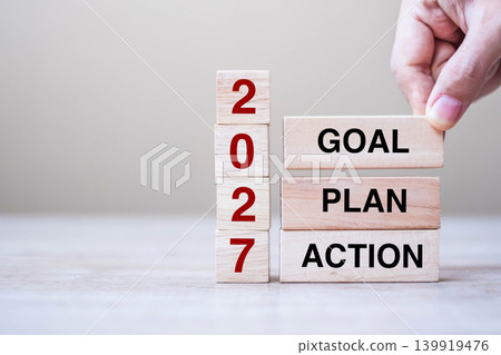 hand holding wooden block with text 2027 GOAL, PLAN and ACTION on table background. Resolution, strategy, solution, goal, business and New Year holiday concepts hand holding wooden block with text 2027 GOAL, PLAN and ACTION on table background. Resolution, strategy, solution, goal, business and New Year holiday concepts 139919476