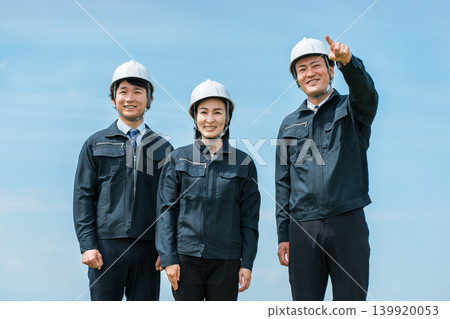 Men and women in work clothes who work in the construction industry, building industry, or for general contractors. Men and women in work clothes who work in the construction industry, building industry, or for general contractors. 139920053