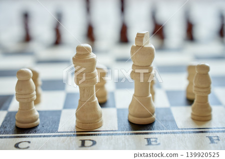 Close-up of white chess pieces on chessboard Close-up of white chess pieces on chessboard 139920525