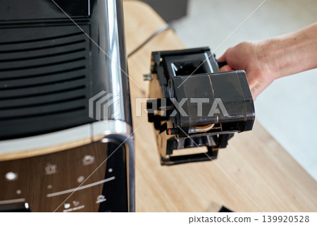 Coffee machine maintenance, removing brewing unit Coffee machine maintenance, removing brewing unit 139920528