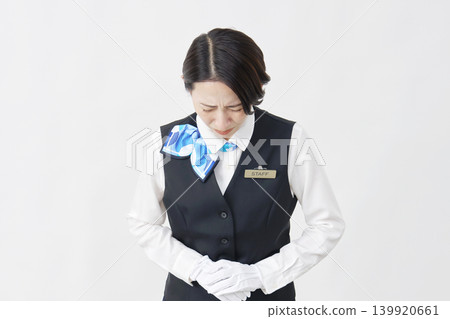 Female staff member, receptionist/bus guide, bowing/apologizing, white background. Female staff member, receptionist/bus guide, bowing/apologizing, white background. 139920661