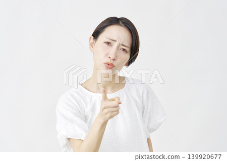 Middle-aged woman, complainer, white background Middle-aged woman, complainer, white background 139920677
