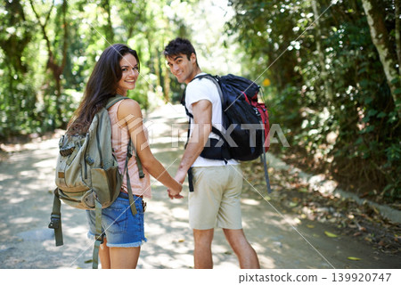 Nature, walking and portrait of couple holding hands for adventure, freedom and hiking outdoors. Forest, travel and man and woman on trail for holiday, vacation and trekking for wellness and fitness Nature, walking and portrait of couple holding hands for adventure, freedom and hiking outdoors. Forest, travel and man and woman on trail for holiday, vacation and trekking for wellness and fitness 139920747