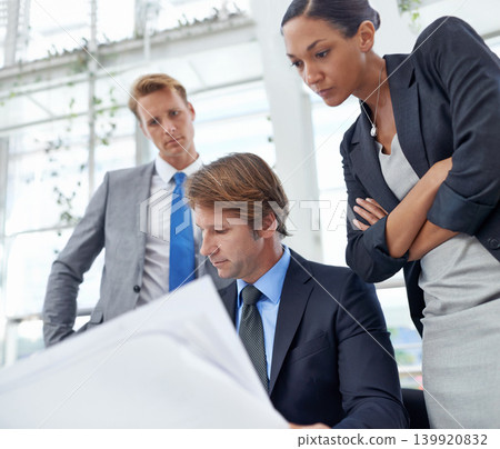 Business people, architect and meeting, analysis of blueprint for building renovation and team strategy with project management. Construction collaboration, engineering and architecture floor plan Business people, architect and meeting, analysis of blueprint for building renovation and team strategy with project management. Construction collaboration, engineering and architecture floor plan 139920832