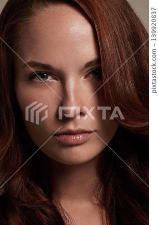 Woman, portrait and cosmetics for haircare in studio, attitude and keratin treatment or shampoo. Female person, serious face and beauty in hairstyle, aesthetic and closeup of dermatology and growth Woman, portrait and cosmetics for haircare in studio, attitude and keratin treatment or shampoo. Female person, serious face and beauty in hairstyle, aesthetic and closeup of dermatology and growth 139920837