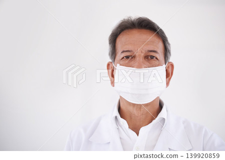 Portrait, dentist and doctor in clinic with mask, mockup and expert advice in orthodontics for medical health. Dental medicine, healthcare and professional with pride, ppe and oral service with space Portrait, dentist and doctor in clinic with mask, mockup and expert advice in orthodontics for medical health. Dental medicine, healthcare and professional with pride, ppe and oral service with space 139920859