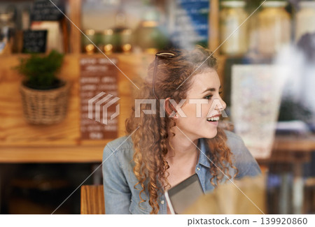 Coffee shop, relax and woman in window with laptop for internet, social networking and website. Happy, smile and person on computer in restaurant, cafe and diner for caffeine, beverage and cappuccino Coffee shop, relax and woman in window with laptop for internet, social networking and website. Happy, smile and person on computer in restaurant, cafe and diner for caffeine, beverage and cappuccino 139920860