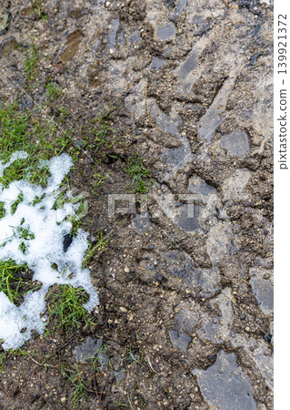 Melting Snow and Muddy Trail During Spring Transition Melting Snow and Muddy Trail During Spring Transition 139921372