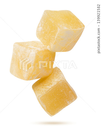 Turkish delight cubes flying close-up on a white background. Isolated Turkish delight cubes flying close-up on a white background. Isolated 139921582