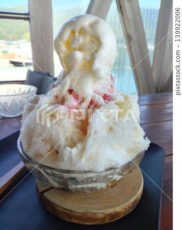 Shaved ice with plenty of ice cream at a cafe with an ocean view Shaved ice with plenty of ice cream at a cafe with an ocean view 139922006