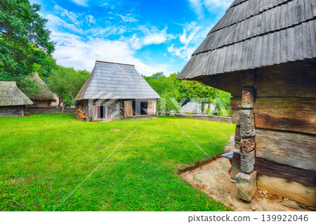 Remarkable summer scene of traditional romanian peasant houses. 139922046