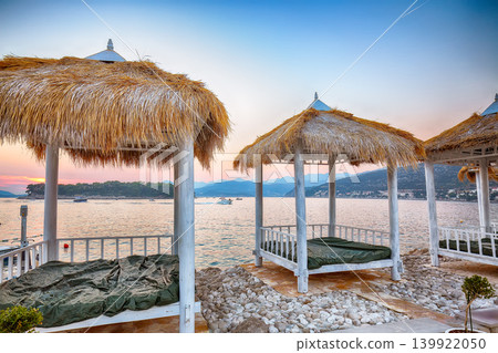Amazing Thatched canopies and awnings on the beach Copacabana at sunset in Dubrovnik. 139922050