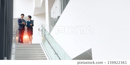 Group of business people having a conversation in the office Group of business people having a conversation in the office 139922361
