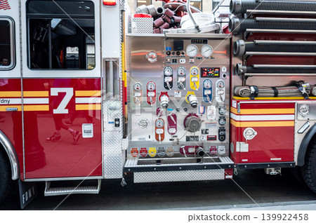 New york, usa august 20,2024. Fdny pumper truck pump panel with gauges, controls and coiled hose on manhattan street emergency response vehicle ready New york, usa august 20,2024. Fdny pumper truck pump panel with gauges, controls and coiled hose on manhattan street emergency response vehicle ready 139922458