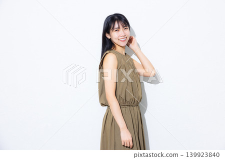 A woman in a khaki dress A woman in a khaki dress 139923840