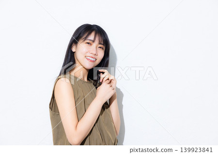 A woman in a khaki dress A woman in a khaki dress 139923841