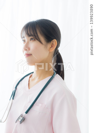 young female nurse in a white coat young female nurse in a white coat 139923890