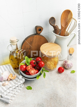 Cooking ingredients and kitchen utensils on counter Cooking ingredients and kitchen utensils on counter 139924390