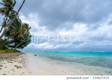 Coral garden beach with turquoise waters and palm trees on Huahine, French Polynesia Coral garden beach with turquoise waters and palm trees on Huahine, French Polynesia 139925474