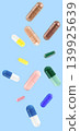 Falling white medicine pills capsule isolated on blue background 139925639