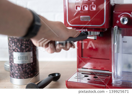 Preparing espresso coffee in a modern kitchen Preparing espresso coffee in a modern kitchen 139925671