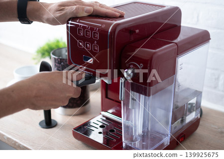 Preparing espresso coffee in a modern kitchen Preparing espresso coffee in a modern kitchen 139925675