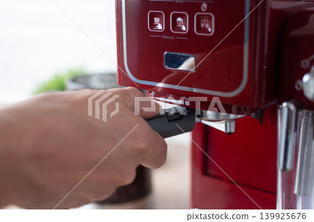 Preparing espresso coffee in a modern kitchen 139925676