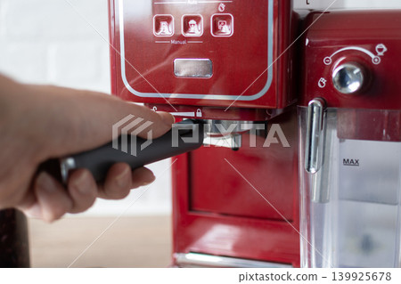 Preparing espresso coffee in a modern kitchen 139925678