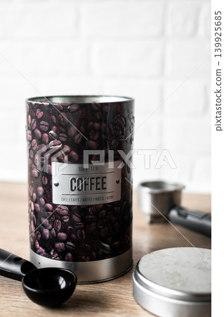 Coffee canister with scoop on kitchen counter 139925685