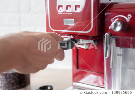 Preparing ground coffee for espresso machine at home 139925690