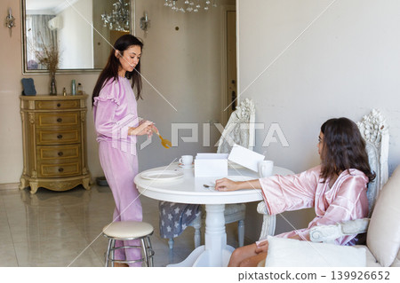 Happy mother and daughter together at home. Breakfast or lunch 139926652