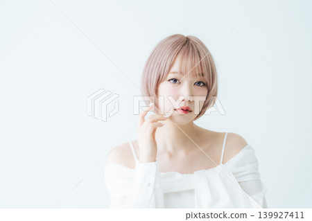 Beauty and fashion image of a woman with light-toned short bob hair. Beauty and fashion image of a woman with light-toned short bob hair. 139927411