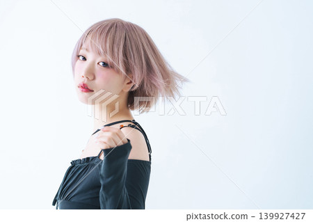 Beauty and fashion image of a woman with light-toned short bob hair. Beauty and fashion image of a woman with light-toned short bob hair. 139927427
