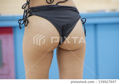 Attractive buttocks in a swimsuit 139927847