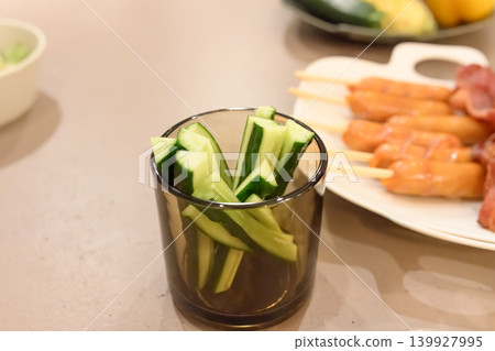 A table of cucumbers and sausages A table of cucumbers and sausages 139927995
