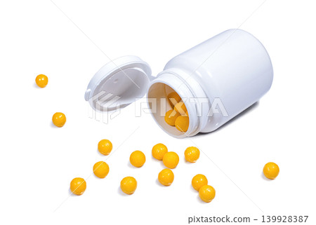 Medical plastic container with orange vitamins Medical plastic container with orange vitamins 139928387