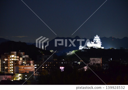 Himeji Castle, a World Heritage Site, beautifully illuminated in the darkness of night. Himeji Castle, a World Heritage Site, beautifully illuminated in the darkness of night. 139928532