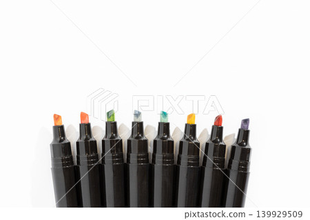 Colorful markers arranged in a neat row on a white background with copy space Colorful markers arranged in a neat row on a white background with copy space 139929509